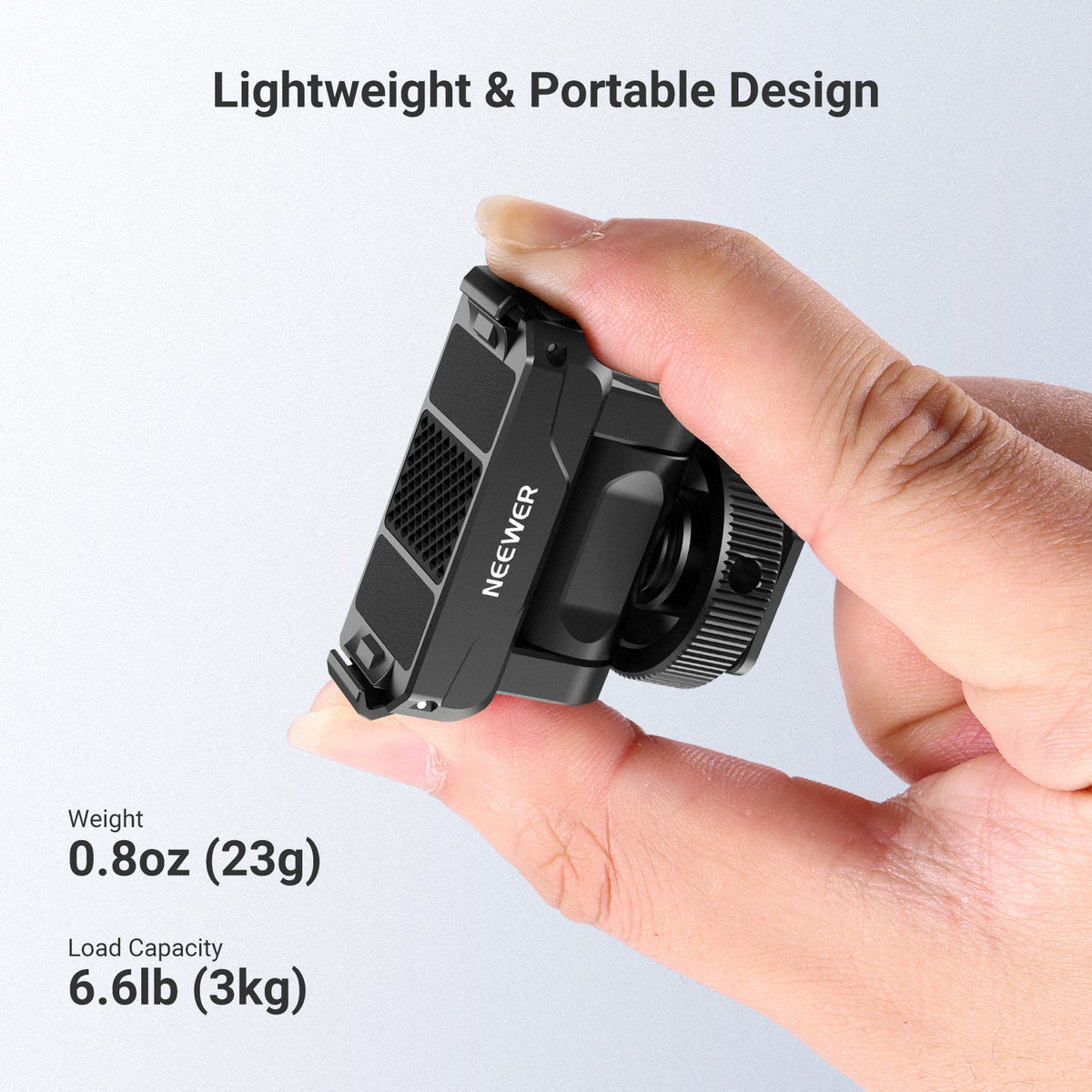 Hold the NEEWER AC072 Magnetic Quick Release Mount with two fingers